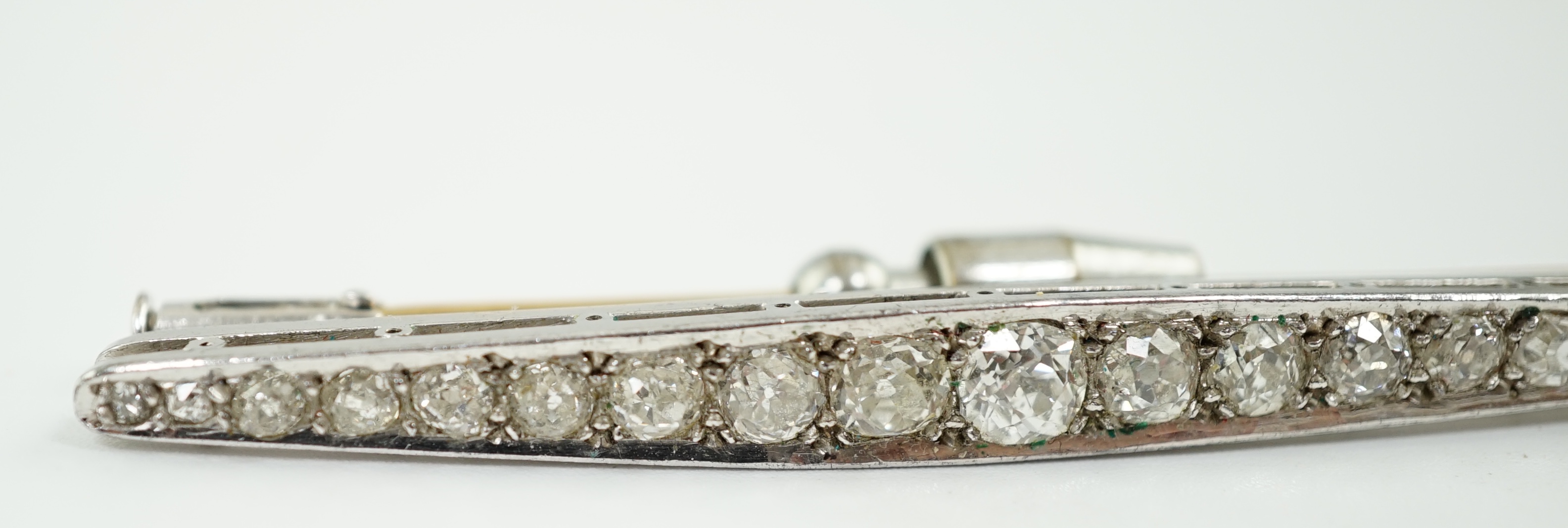 An early to mid 20th century platinum and graduated eighteen stone diamond set bar brooch